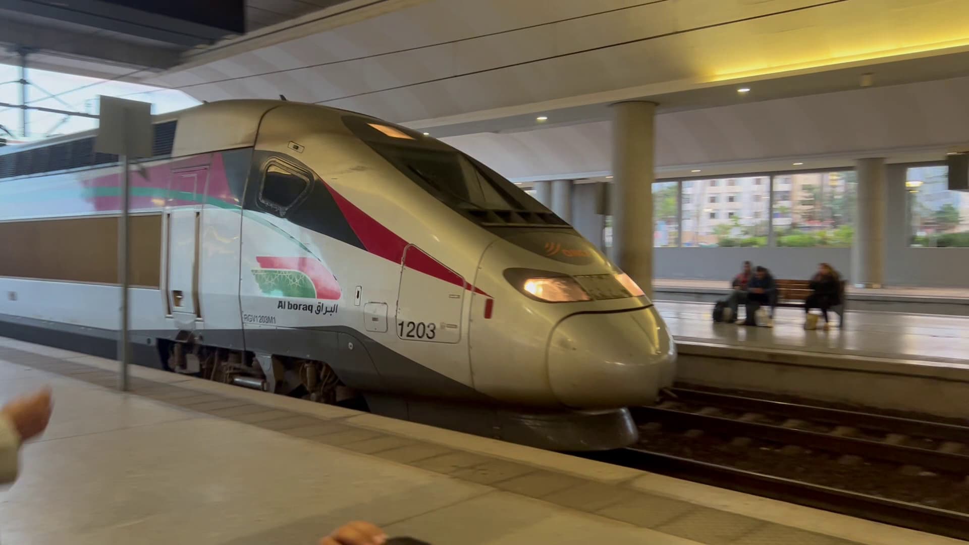 A bullet train pulling into a train station