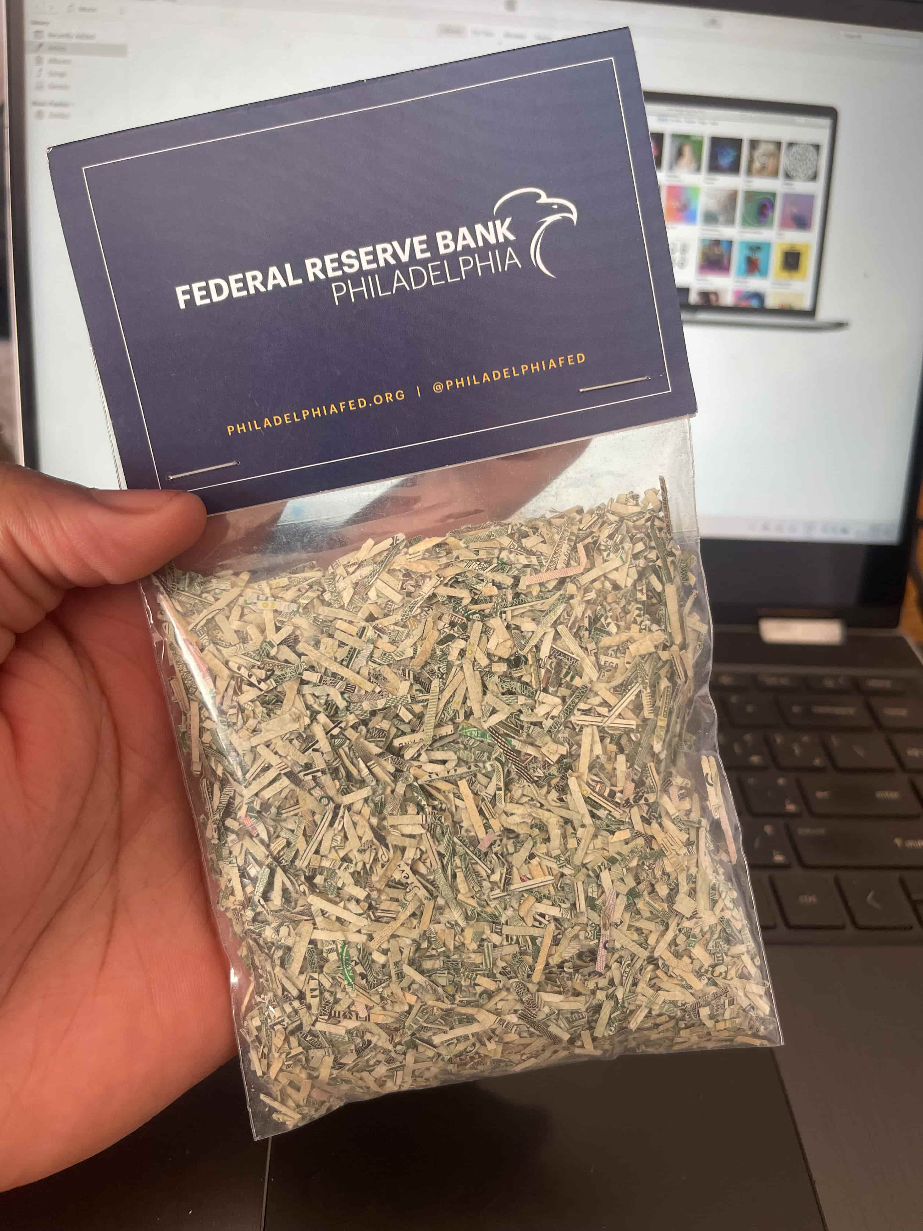 A bag of shredded bank notes labelled Federal Reserve Bank Philadelphia with an eagle logo