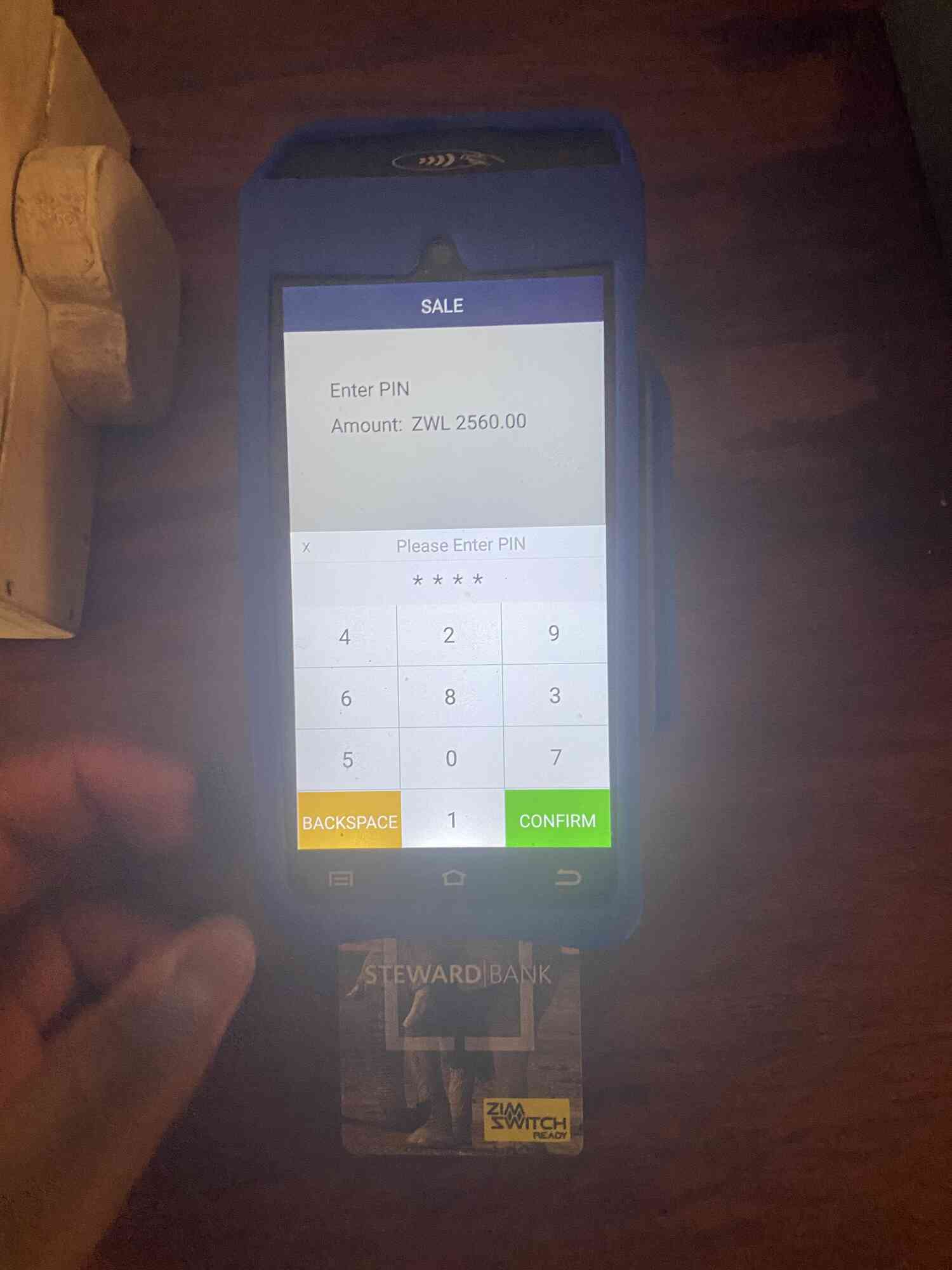 a card swipe machine where the touch pad for the pin has scrambled numbers